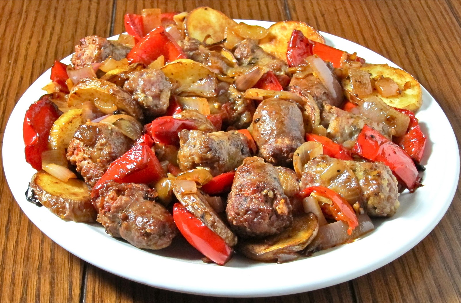 422927 طريقة عمل صينية البطاطس بالسجق 1