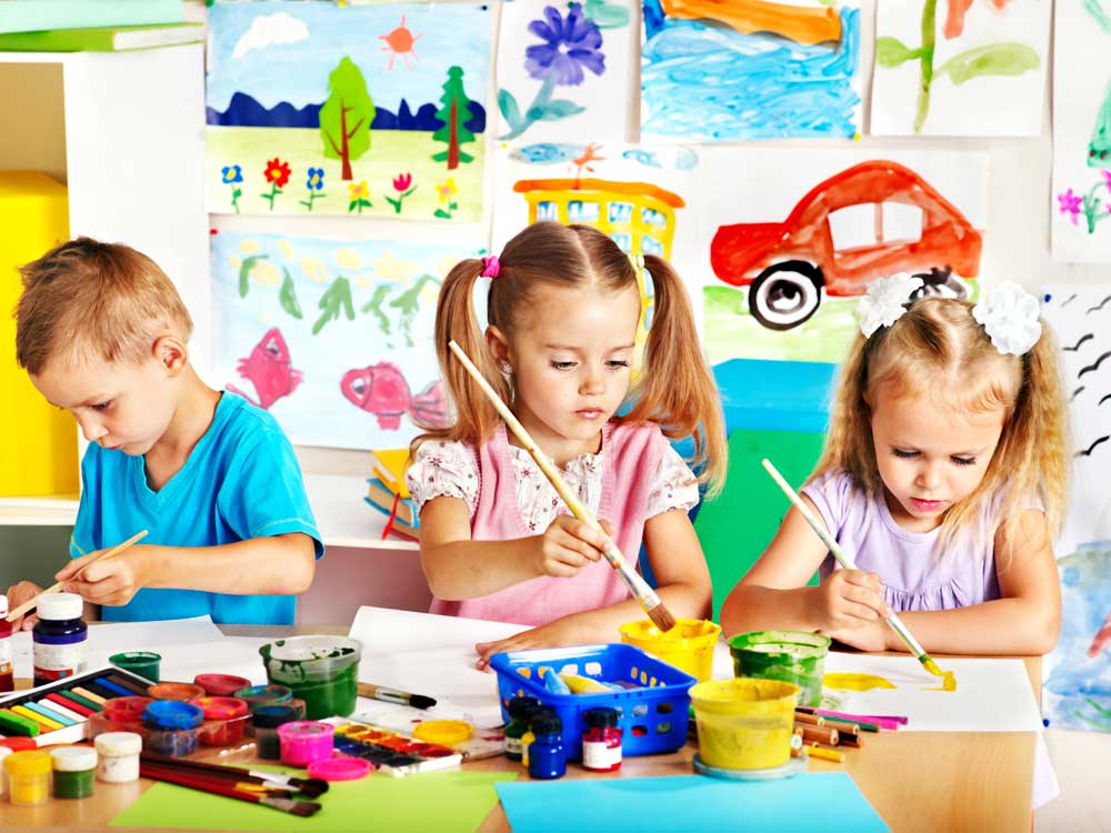 bigstock child painting at easel in sch 49701068