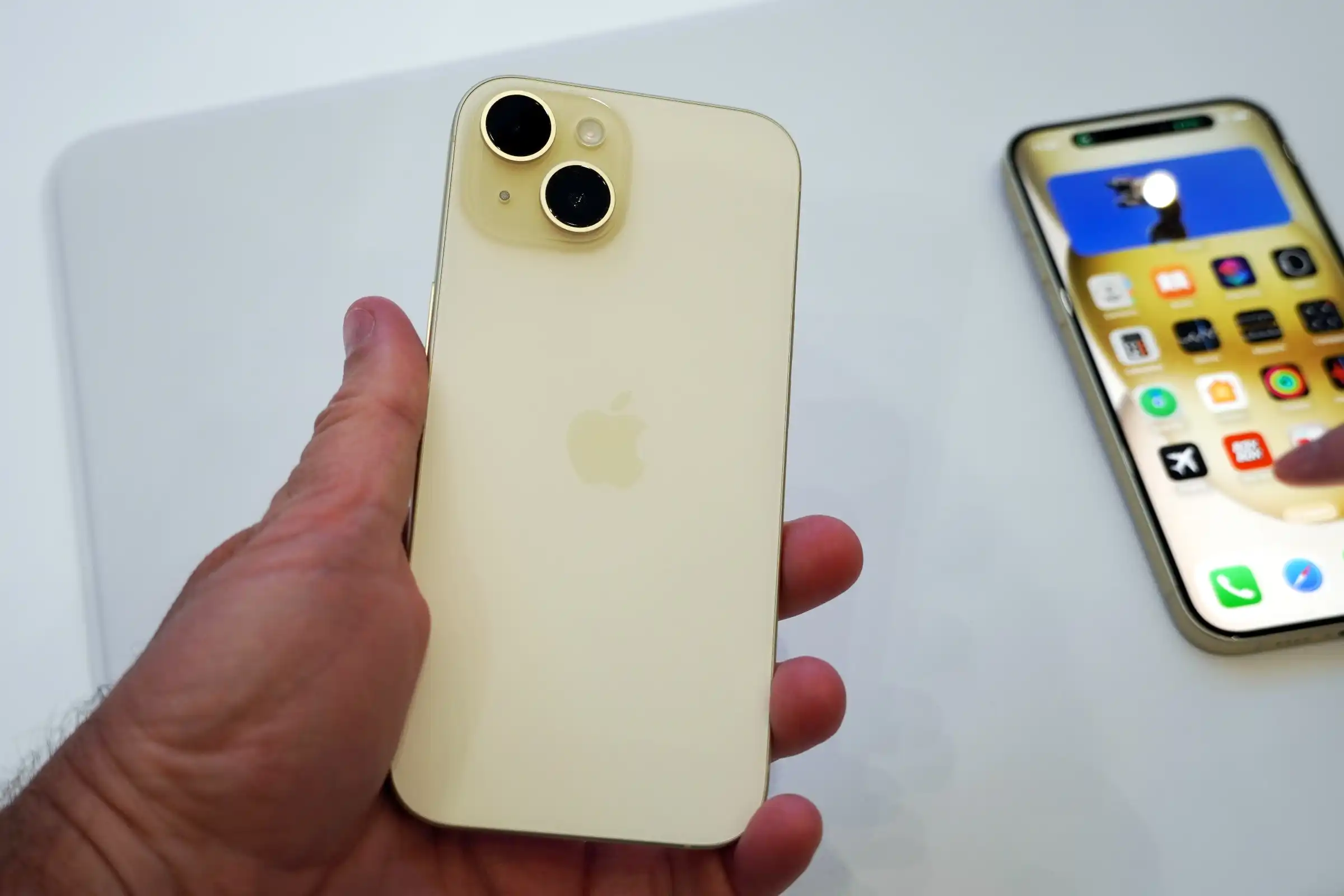 iphone 15 yellow in hnad