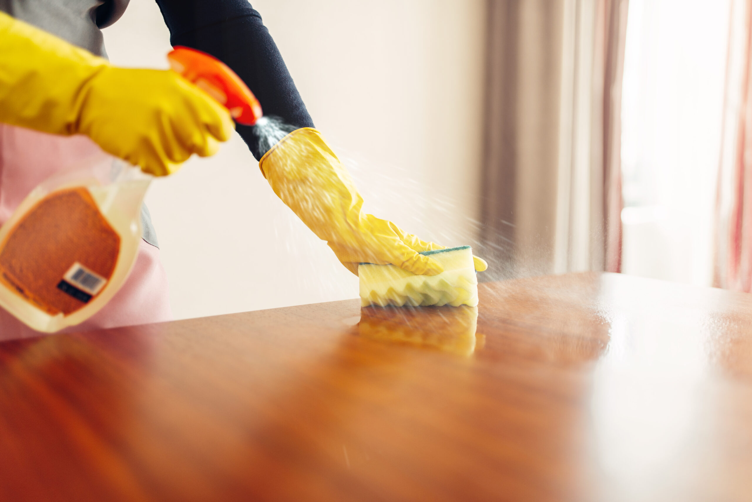housemaid hands cleans table with cleaning spray tpd9f7s scaled